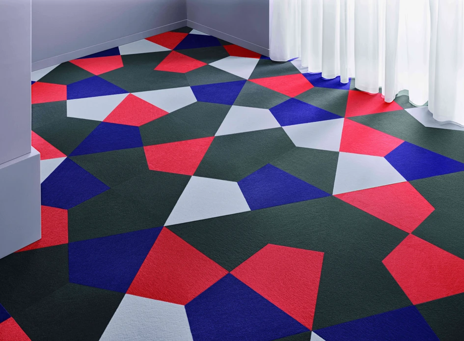 Carpet tiles from Vorwerk flooring, as with the free-form tile Crystal shown here, can withstand even extreme stress levels – without losing their shape