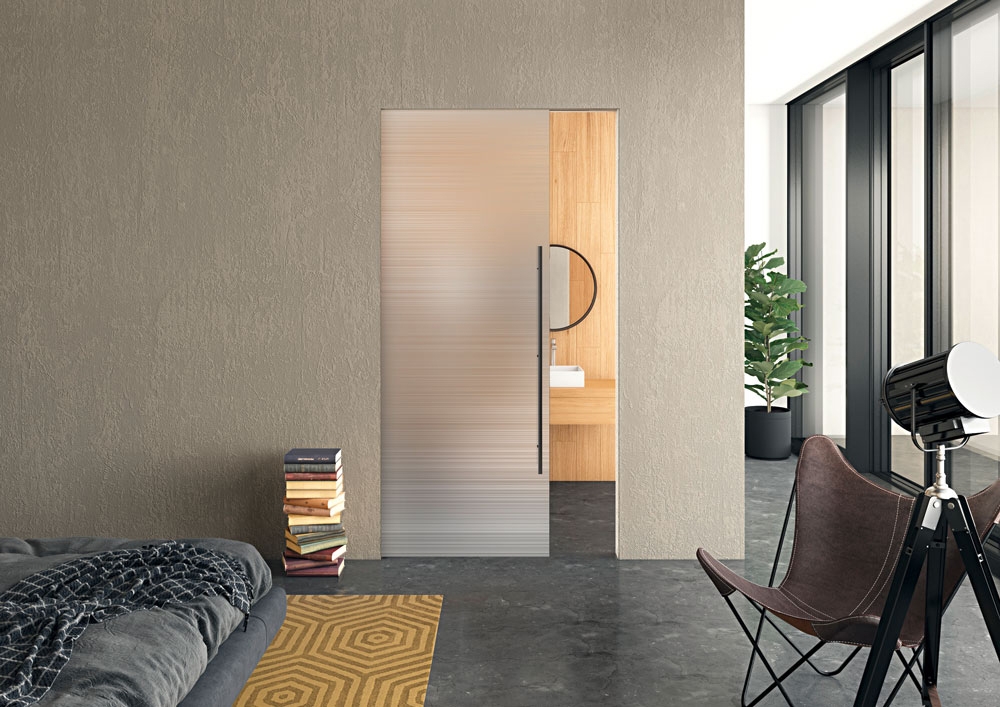 Minimalism thanks to frameless design: Belport is also available with a glass door leaf in addition to wooden door leaves. A retractable damper ensures gentle and automatic closing over the last few centimetres