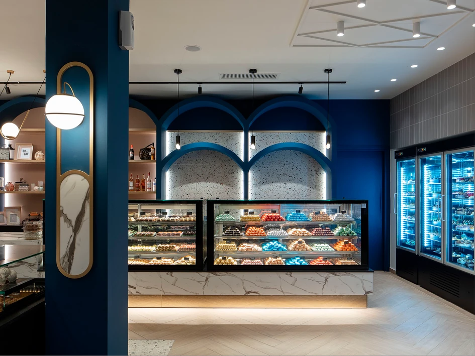 Greek architecture studio G2 Lab collaborated with Cleaf on the interior of Bochotis, a new pastry store in Ioannina, Greece. The blend of colours and materials are aimed at offering a tasteful experience in a sweet-inspired, sophisticated space