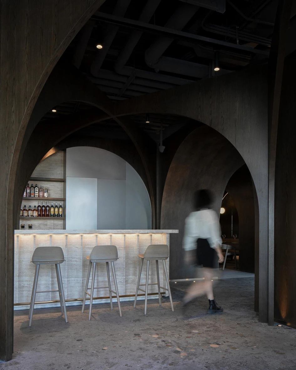 By combining sculptural timber elements with a polished concrete floor, MARS Studio's SOMESOME Bar & Restaurant creates a strong spatial framework for understated contemporary furnishings. Photos: UK Studio