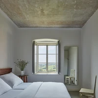 Exposed and whitewashed walls, as well as antique furniture, add to the rustic appeal of the renovated Kocanda hotel in Kravsko, Czech Republic, by local practice ORA. Photos: BoysPlayNice