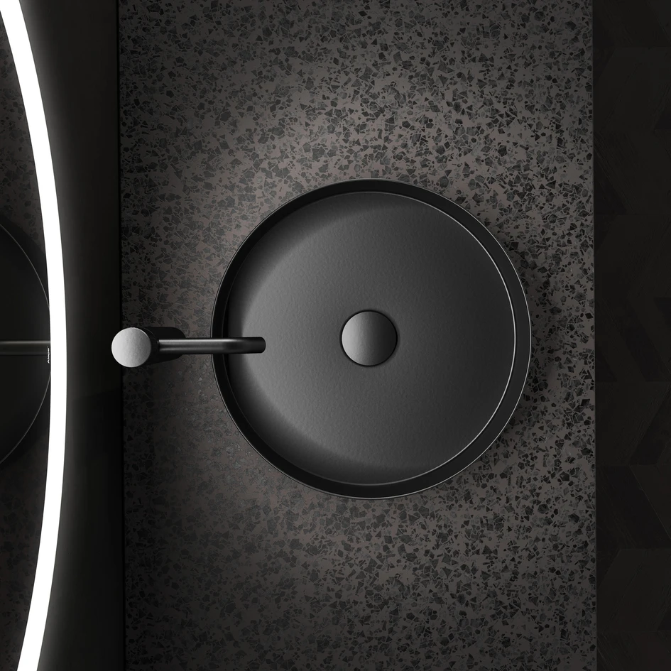 The intimacy of the bathroom is given special expression with Matt black surfaces that are now part of Alape's standard range and seen here in the circular Unisono series as well as the clean-edged Stream