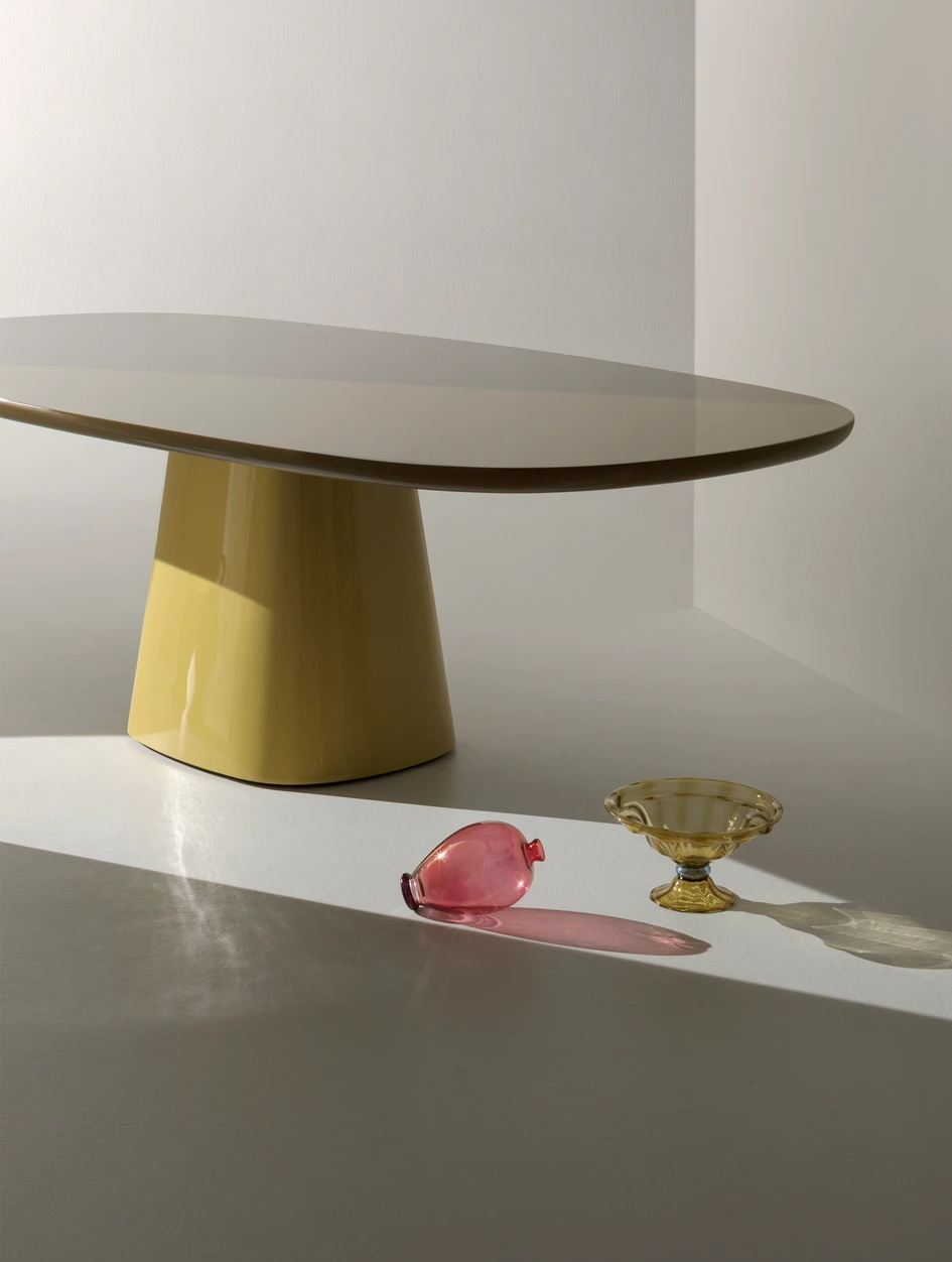The glamorous curved Allure O’ table designed by Monica Armani for B&B Italia