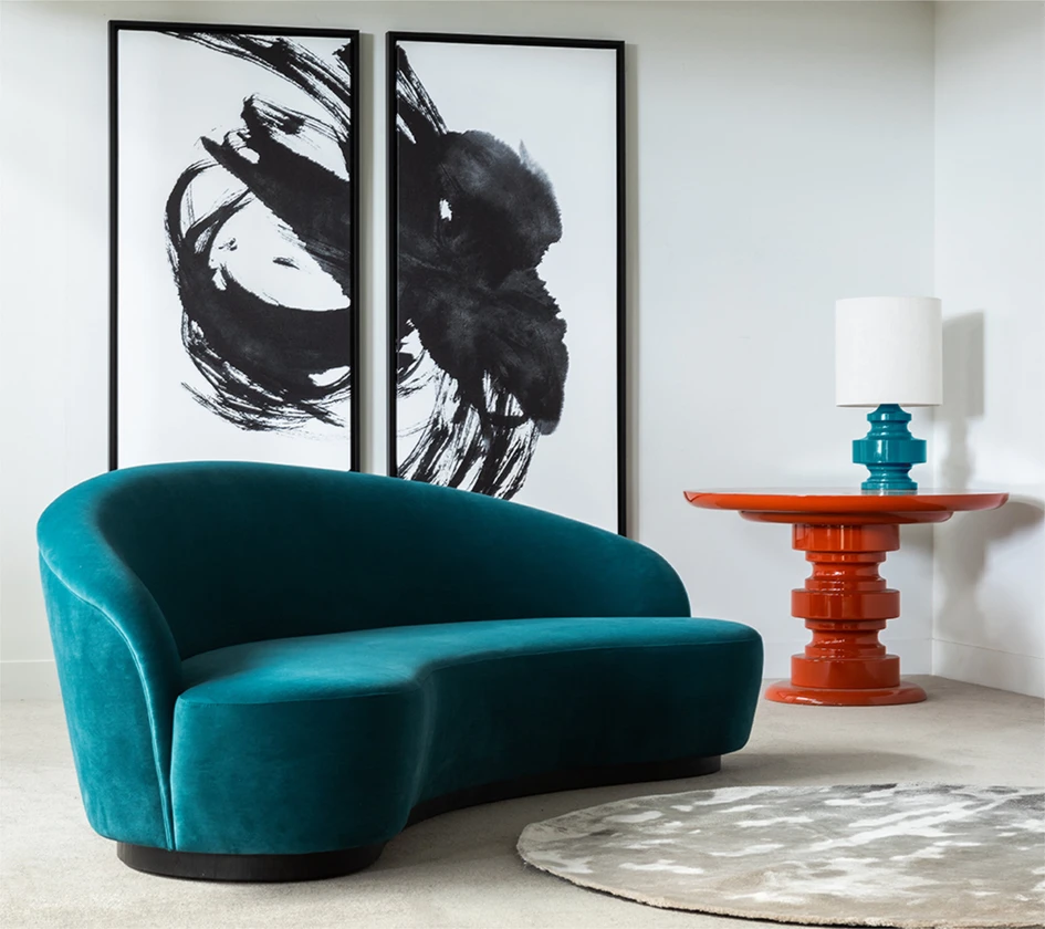 The Ignacio sofa is a classic piece in the curvilinear collection and comes with a symmetrically arched profile or a less regular silhouette which swoops lower at one side across the back