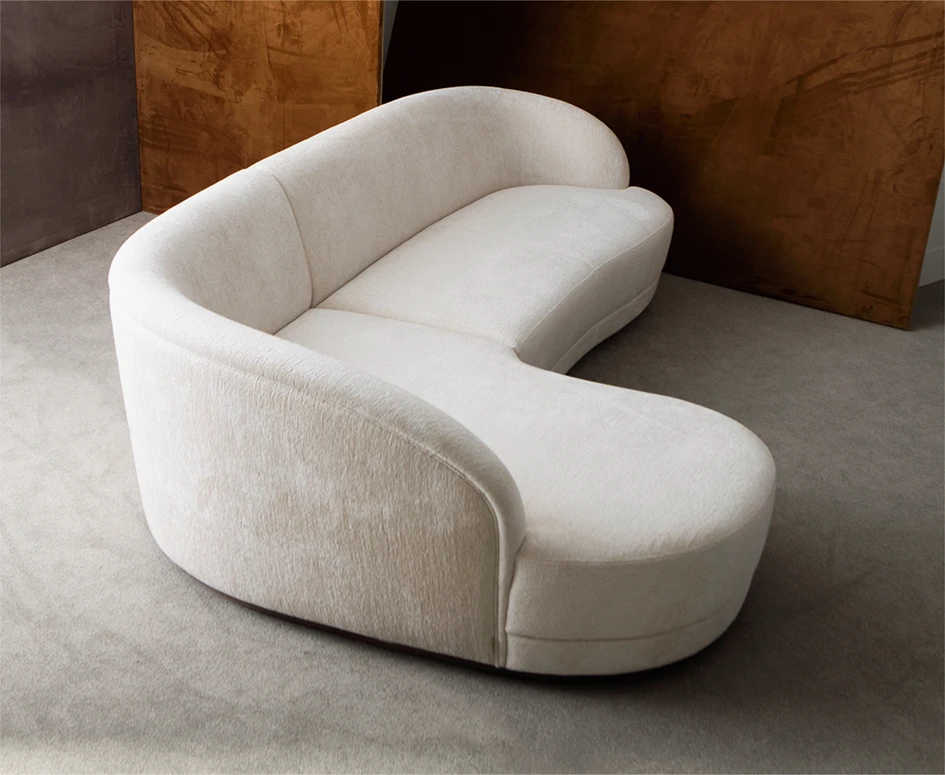 This season Hamilton Conte has developed a modular version of the Barbara sofa that reinvents the L shaped sofa with no sharp corners to be seen, only an amoebic bend