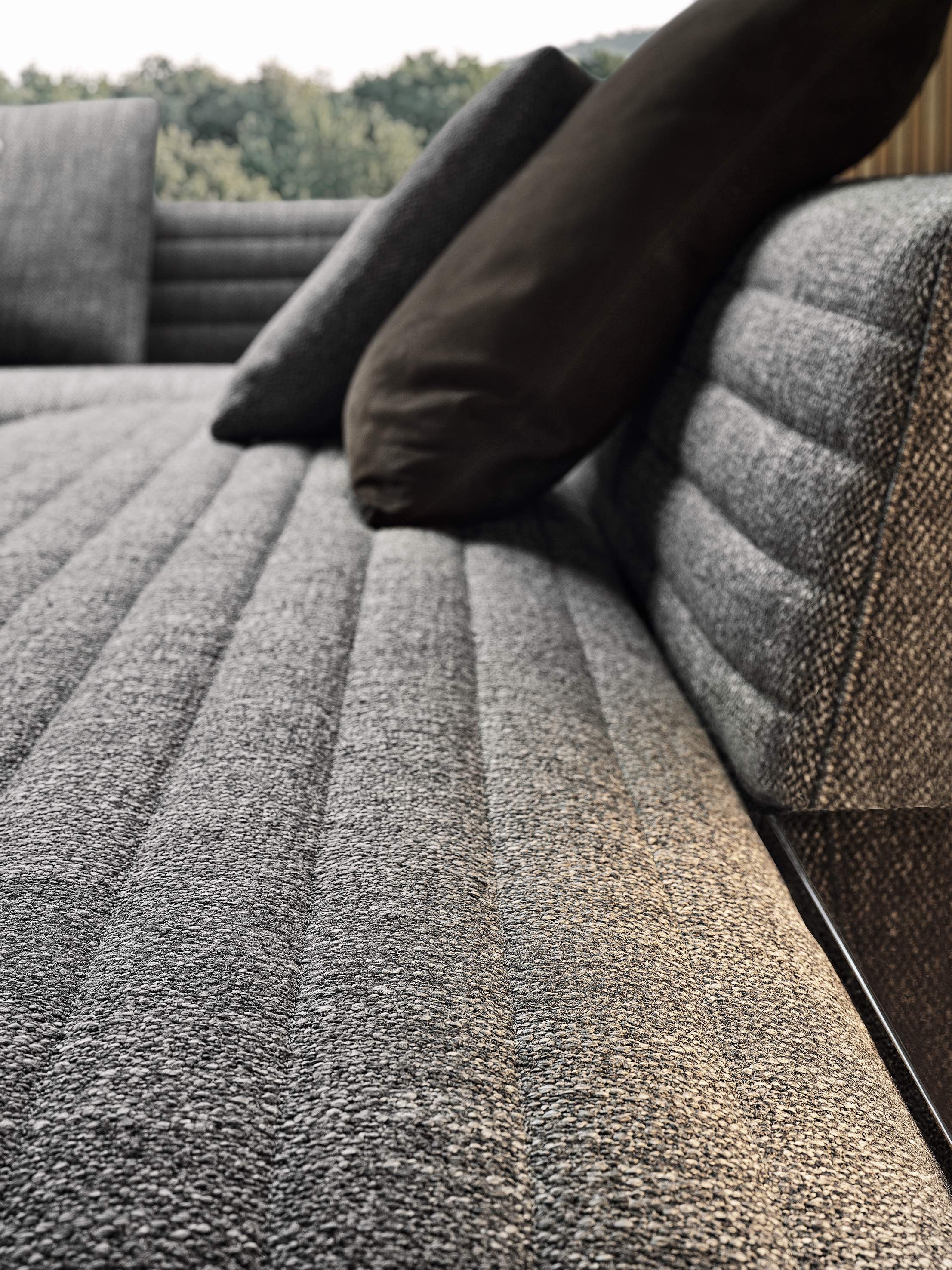 Top: Minotti has invested hugely in upgrading Minotti Studio’s creative and technical facilities. Above: expertly crafted quilted upholstery on Rodolfo Dordoni’s Roger Spring sofa