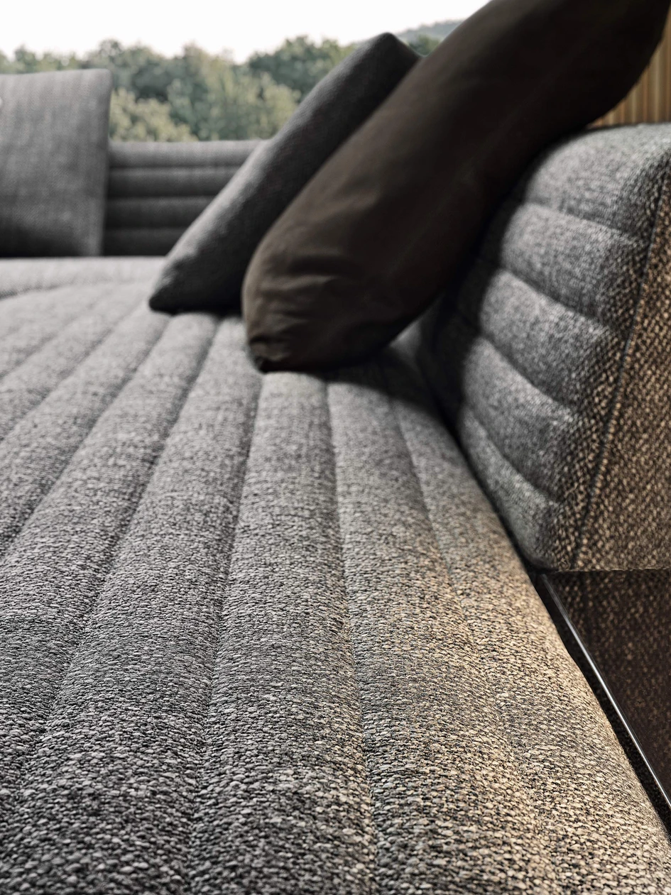 Top: Minotti has invested hugely in upgrading Minotti Studio’s creative and technical facilities. Above: expertly crafted quilted upholstery on Rodolfo Dordoni’s Roger Spring sofa