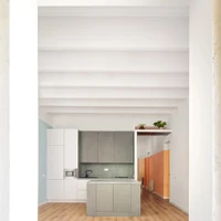 In the Magic Box Apartment, Raul Sanchez Architects deliberately create blurred boundaries between the living room, the open kitchen, and the hallway that connects the rest of the space. Photos: José Hevia