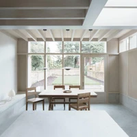 DGN Studio's Concrete Plinth House features a pared-back open kitchen which is visually connected but functionally separate from the rest of the house. Photos: Nick Dearden