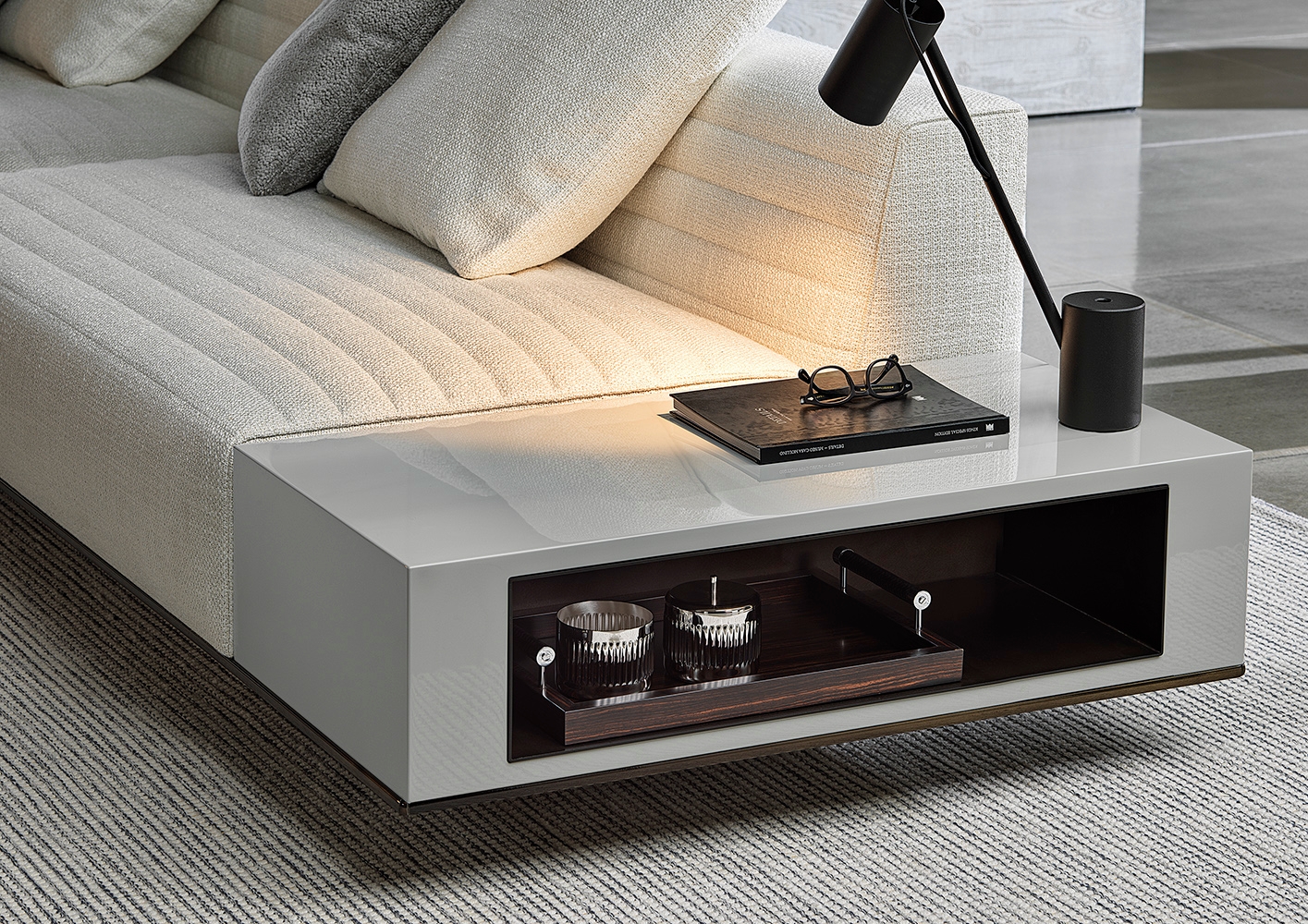 Tactile, elegant quilting – and the option of personalising Roger with Case side tables in various finishes – gives the design even more individuality