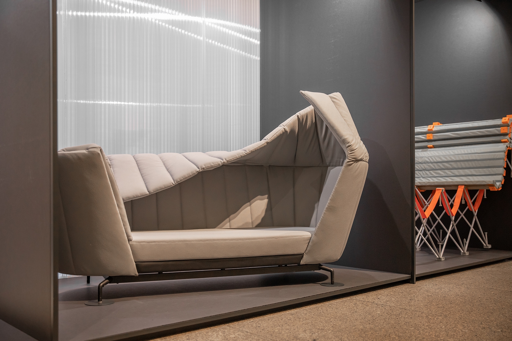 To create more flexibility in the realm of office furniture, Alice Klarwein (top) suggests a desk on castors that can be transformed into a shelf. Steven Dahlinger creates a retreat-on-demand with his sofa