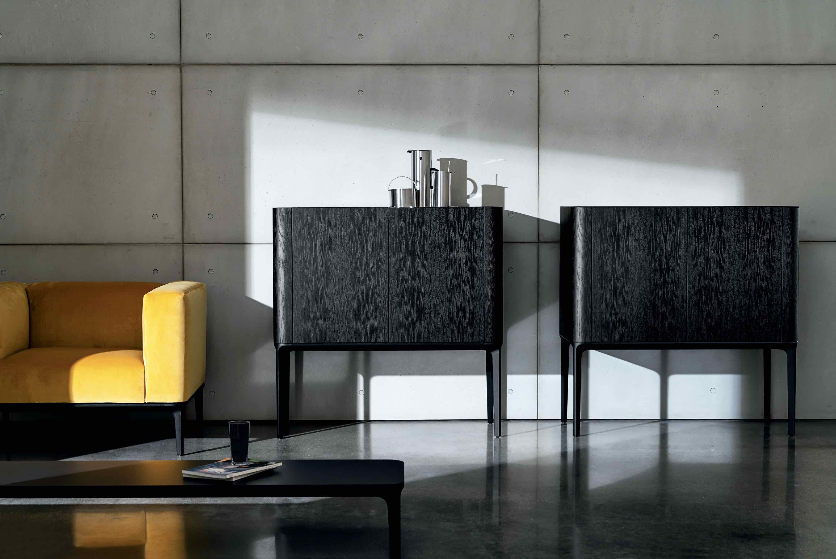 The Slim sideboard demonstrates how the new palette of materials mix harmoniously within one piece. An aluminium structure supports wooden cupboards and a top made from ceramic or glass