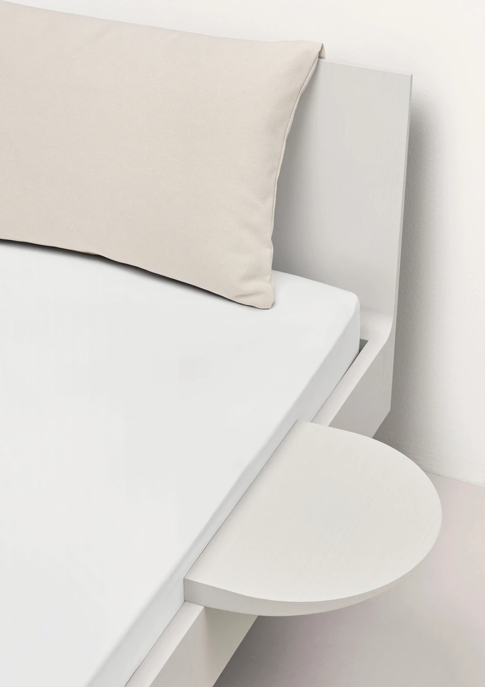 Bed Ais is made of solid Swiss ash wood, is available in four colours and a natural shade and comes with matching individual or hook-on side tables