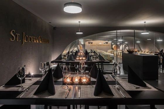 Horgenglarus' Lyra chairs and bar stools accompany a different kind of view in the winery restaurant. Photo: Thomas Andenmatten