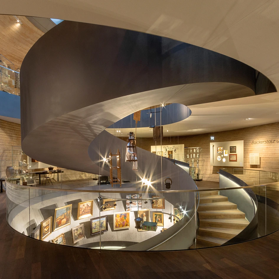 Similar in shape, spiral and helical stairs differ in both radius and grandeur