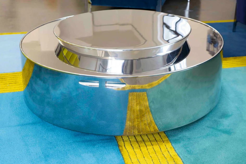 All Softicated products can be combined to form a coherent three-dimensional interior collage. Two examples of the Gustav collection's desk are shown here, along with a Belvedere daybed in yellow, and a close-up of a chrome table with two levels (below)
