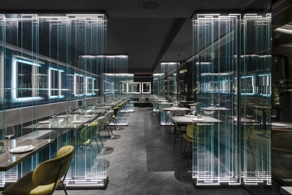 Transparent glass features as a striking installation, as well as subtle partitioning, in the Moya restaurant in Como, Italy. Photo: Andrea Martiradonna
