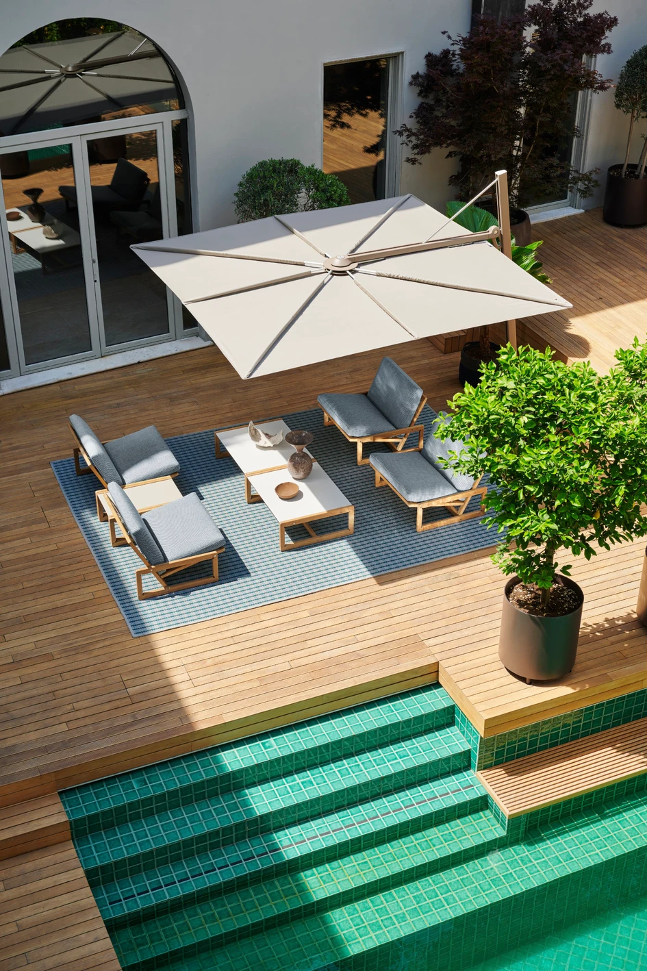 Afra and Tobia Scarpa’s 1967 Carlotta small armchair has been reissued for the outdoors by Cassina. It sits happily alongside new designs such as the innovative Cassina Parasol. Photo: Valentina Sommariva