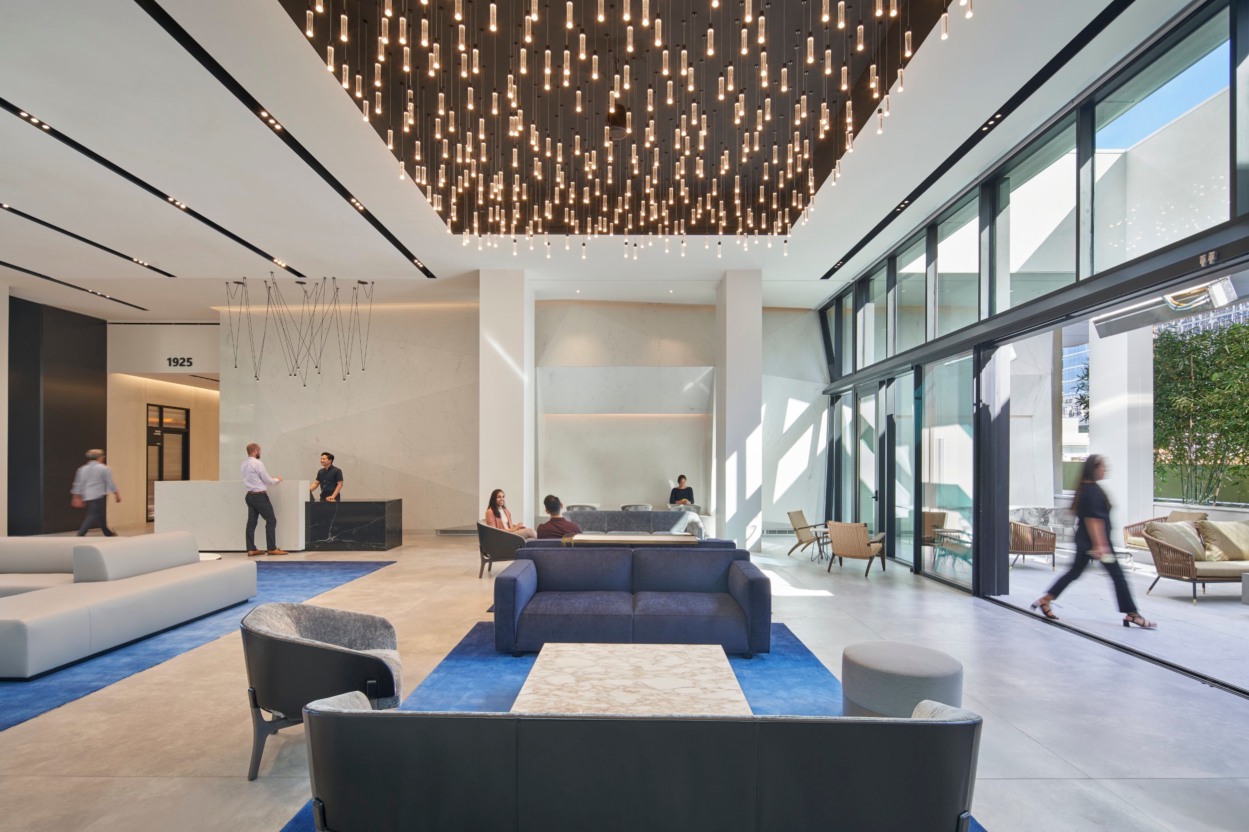 The cylindrical P1M pendant light multiplied to form a dramatic installation in the Watt Plaza office building in Los Angeles