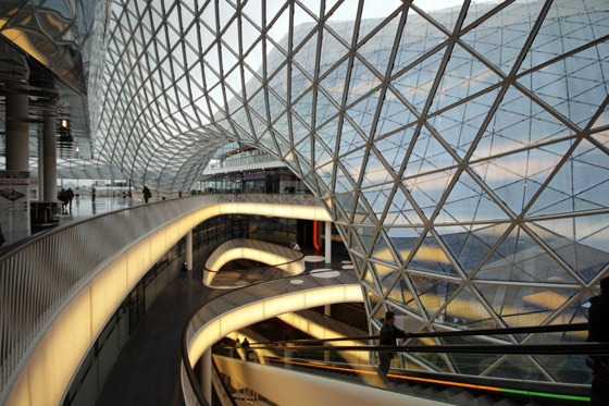 Magical three-dimensional forms can be created with glass, bursting out of stone at Galleria in Gwanggyo (top) or pulled inside by gravitational force at Myzeil (mid, bottom). Photo (top): Hong Sung Jun, OMA