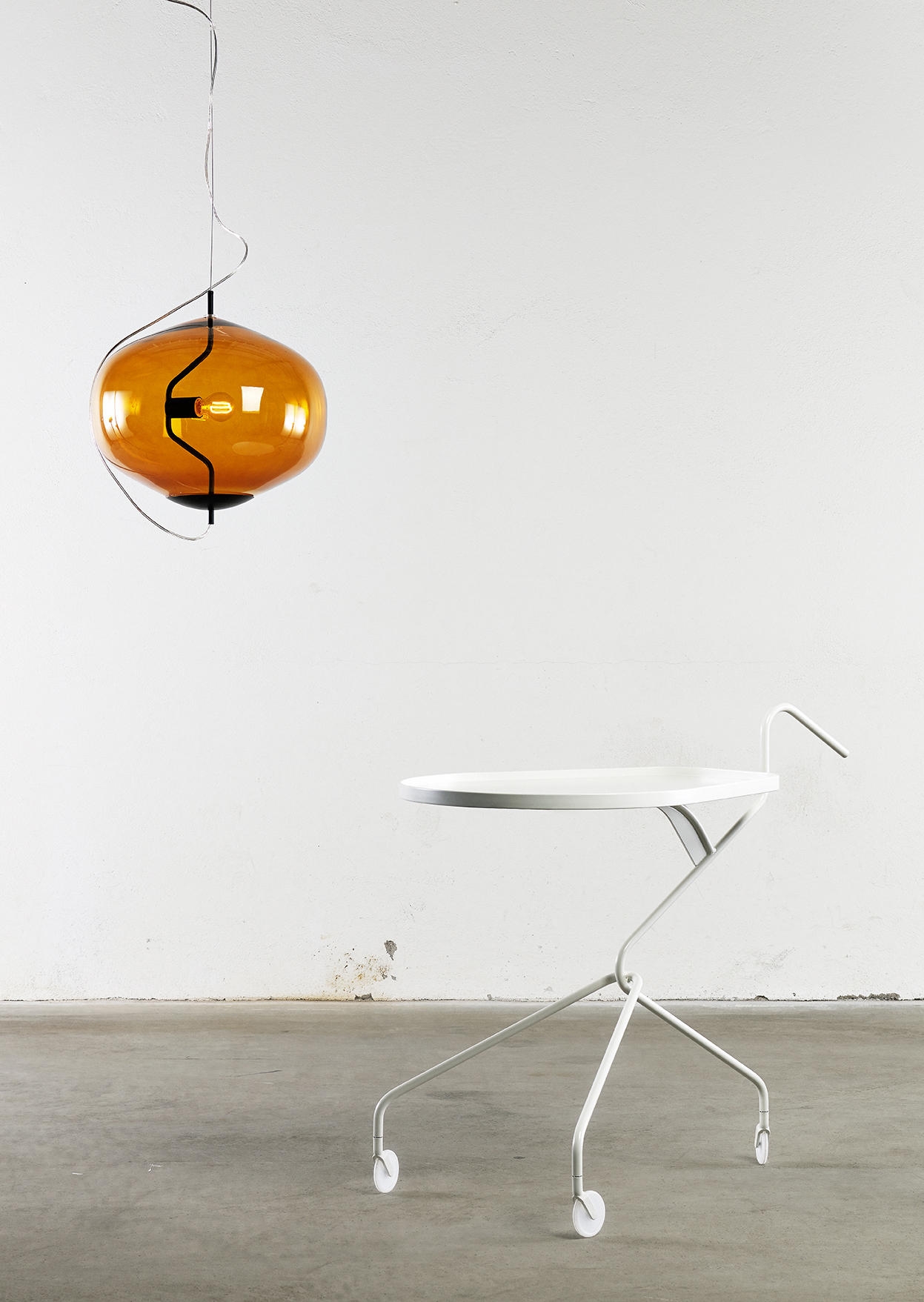 The #FO15 home's preserved skylight showers its living space with light (top) while GAN's cosy knitted stools (middle) and David design's amber Fondue light (bottom) bring warmth. Photo: Erik Lefvander (top)