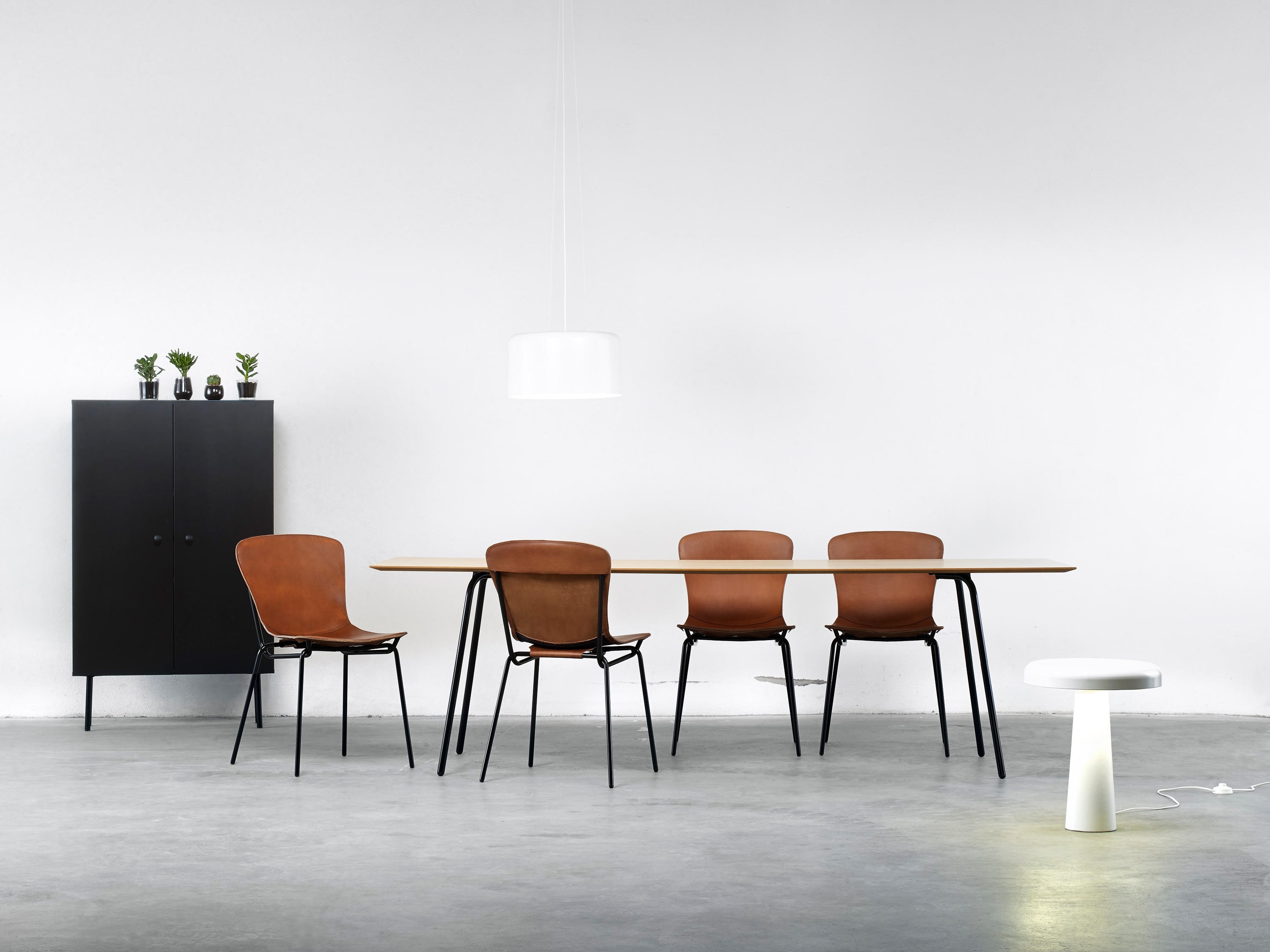 David design's Oto (top) and Hammock (bottom) seating collections feature wood frames and leather seats, respectively