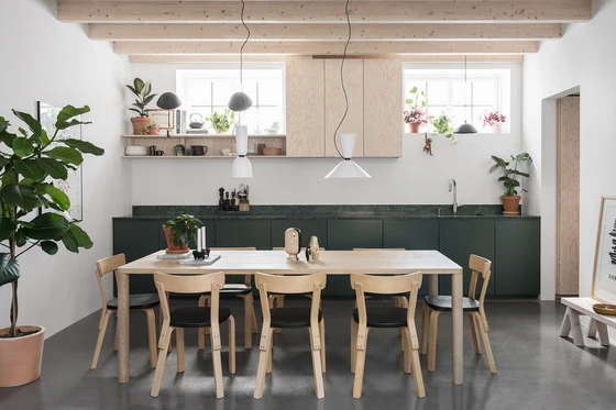 The #FO15 house's kitchen scene combines light and natural surfaces with dark accents of deep green and black. Photo: Erik Lefvander