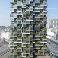 Stefano Boeri Architects' Easyhome Huanggang Vertical Forest City Complex creates mini-parks with trees and shrubbery planted on each enclosed balcony's canopy. Photo: RAW VISION studio