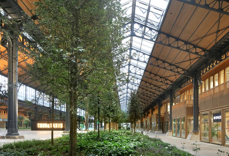 The Gare Maritime Workspace is a covered city with workplaces, retail units and wide boulevards, surrounding a central event space and gardens. Photos: Filip Dujardin © Neutelings Riedijk Architects