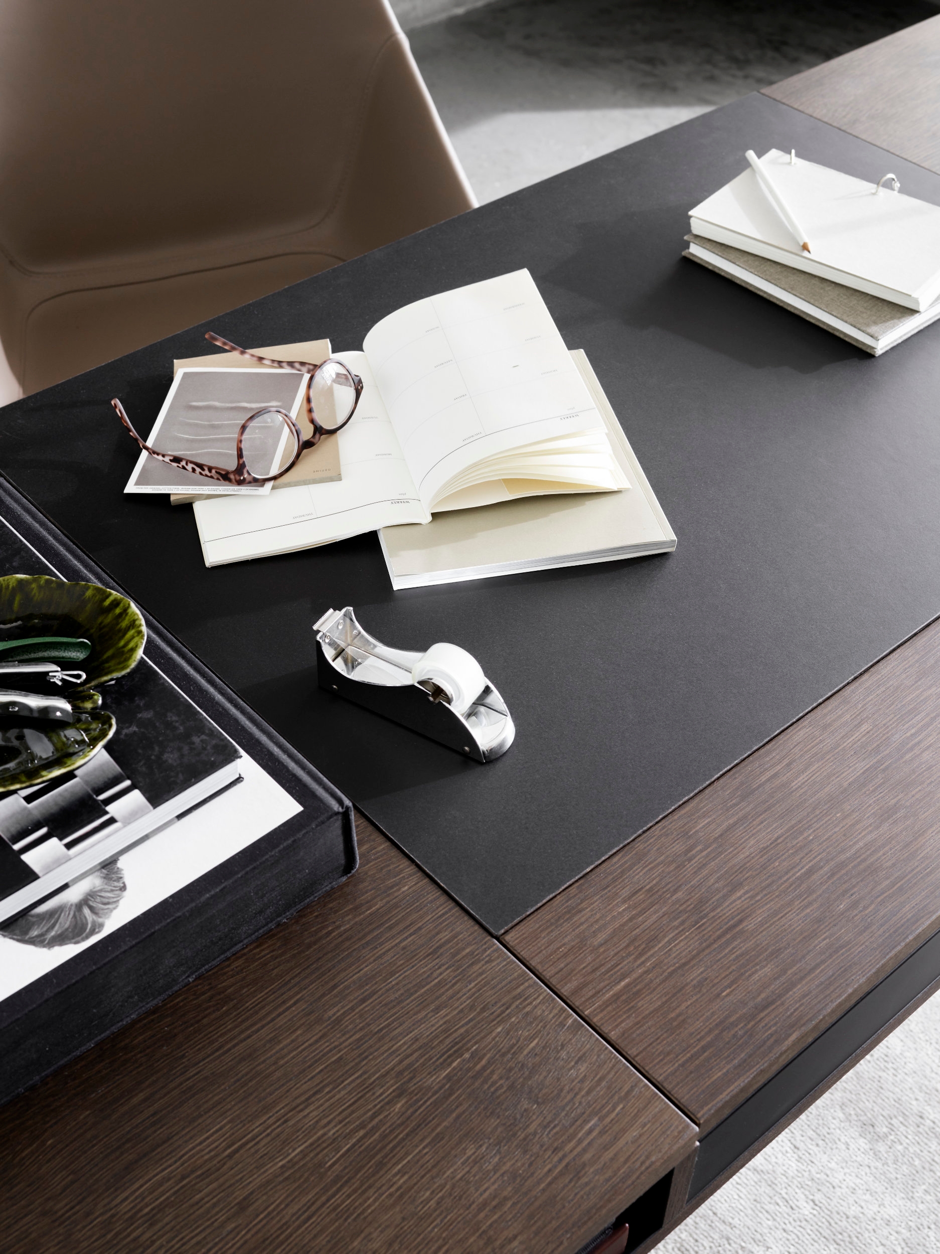 Colours and materiality have an important impact on how we feel in a space, and so do the objects in it. BoConcept's Cupertino desk in dark oak veneer, combined with other pieces in leather, copper and fabric add elegance to the room