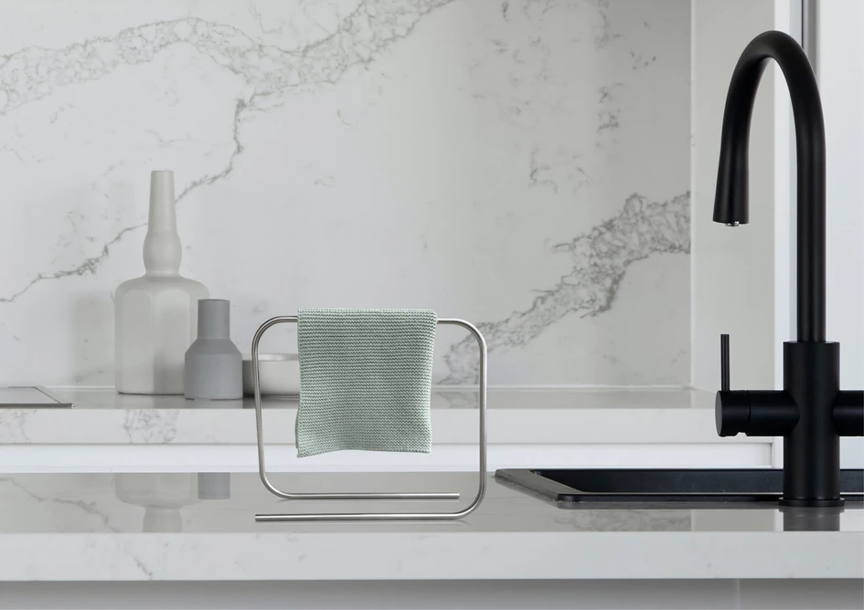 'It's flat, flatter': this is Bette's motto for BetteAir, the first ever shower tile made of glazed titanium steel (top); inbyko's minimalist looper sink cloth holder is available in stainless steel, chrome or gold (bottom)