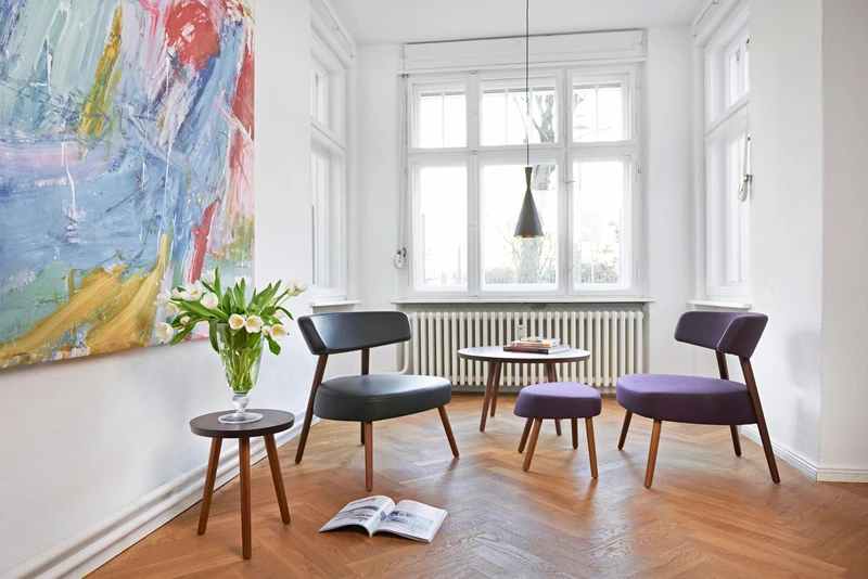 Marlon Lounge chairs and footstools from Axel Veit have a light yet comfortable form, perfectly suited to small seating zones, without overwhelming the space