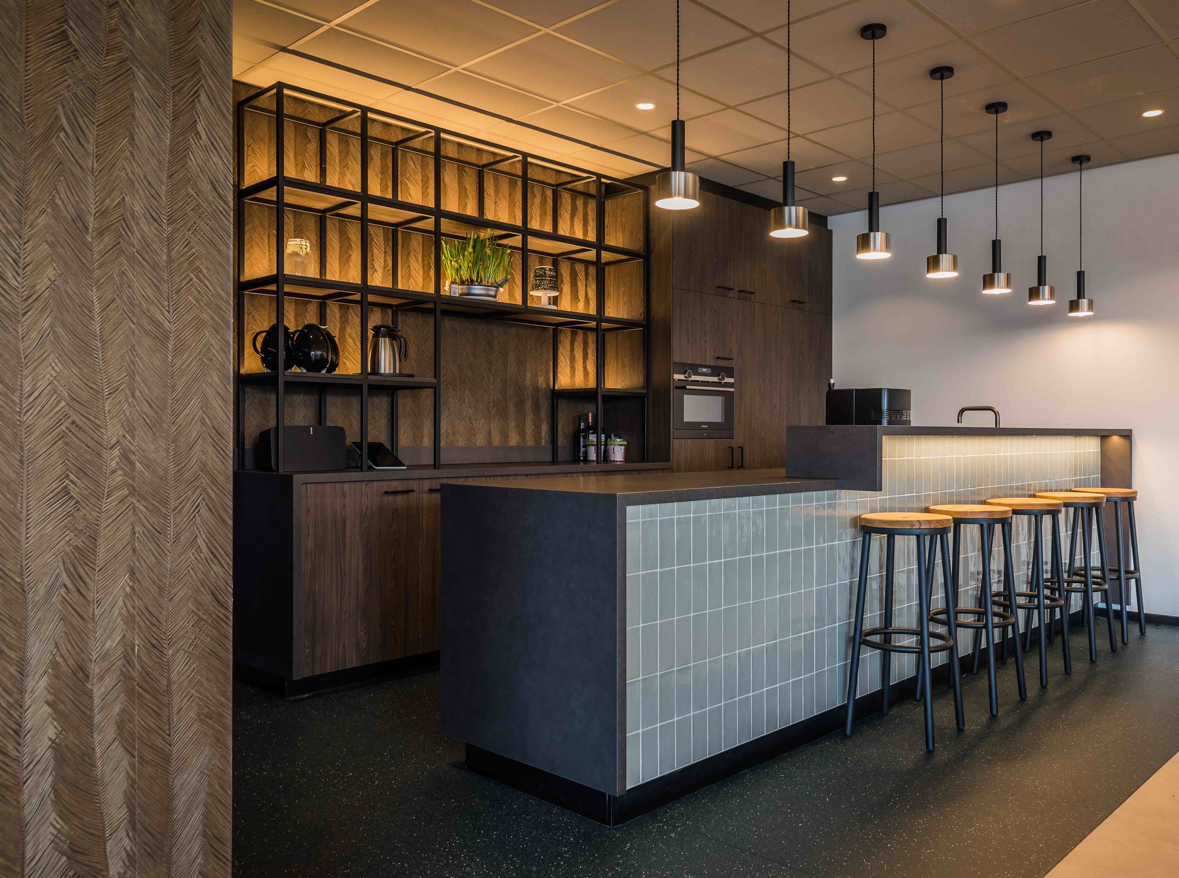 A multifunctional space on the ground floor is made for staff relaxation and contains a games corner, café and bar, the latter designed using cabinetry in Unilin’s Dainty Oak Café Noir
