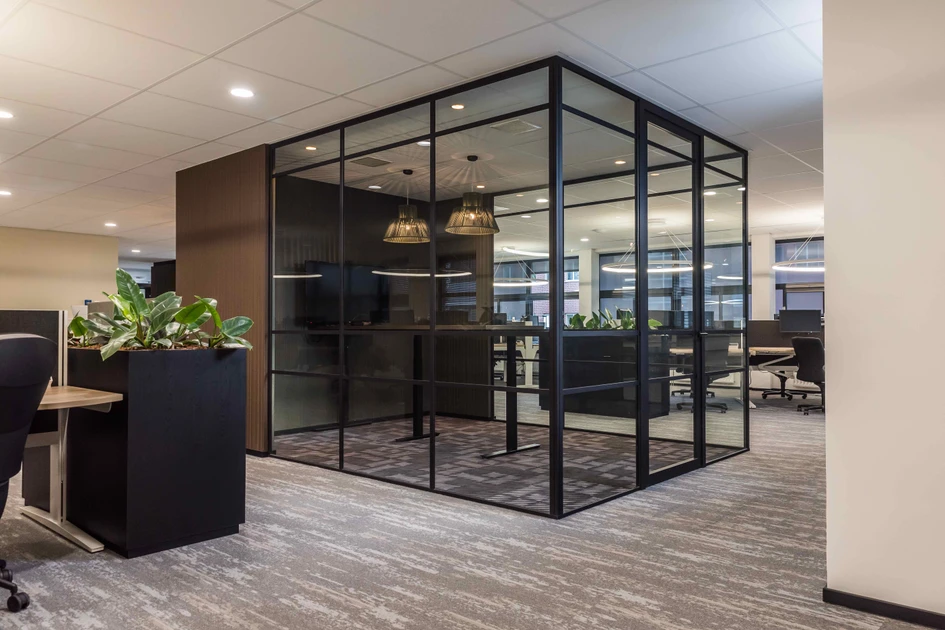 Offices for digital agency TrueLime were designed by Dutch interior designers Art 2 Go, using Unilin panels throughout. Glass meeting rooms are surrounded by storage stations in Unilin’s Elegant Black