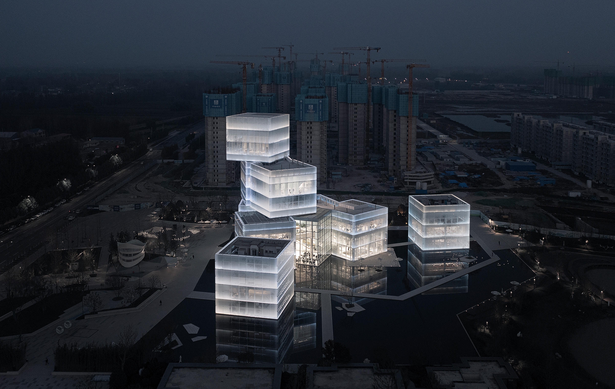 For its Cultural Tourist Center project in Xinxiang, China, lighting consultants PROL have installed luminaries between two glass layers, creating a subtle, lantern-like effect. Photos: TOPIA Vision