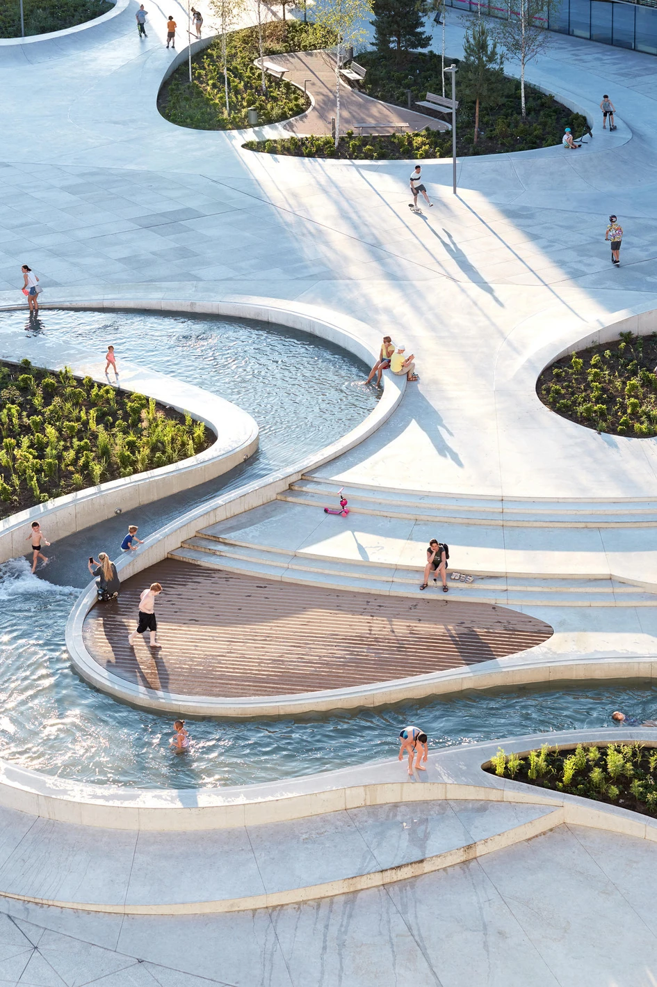 3Deluxe's V-Plaza Urban Development project in Kaunas, Lithuania is designed as a relaxing yet dynamic public space located within an ultra-modern commercial setting. Photos: Norbert Tukaj