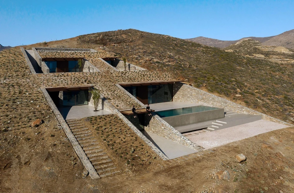 MOLD Architects protected the NCaved house from the strong north winds of Greece’s Aegean Sea by digging it into the coastline hillside. Photo: MOLD Architects