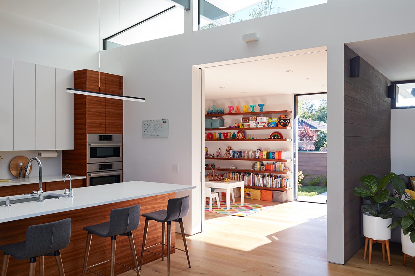 Pocket doors like this one at a Los Altos residence by Klopf Architecture provide access to small rooms without wasting internal floorspace on a door swing. Photo: ©2018 Mariko Reed