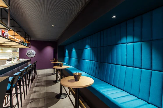 Le Coiffeur’s shared material flooring (top) and the Momentum hotel’s upholstered seat and wall (middle, bottom). Photos: Laure Mélone for Margaux Keller (top), Atlas Concorde (bottom)