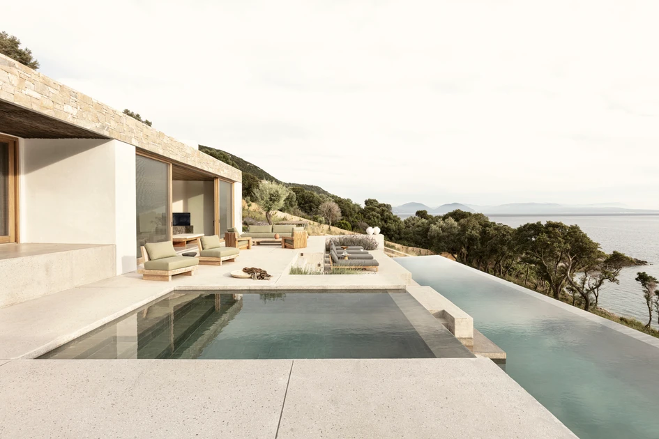 For minimal impact on the hillside views, Villa Apollon’s partly submerged form includes multiple exterior seating, dining and swimming zones that step down towards the sea. Photos: Yiorgos Kordakis