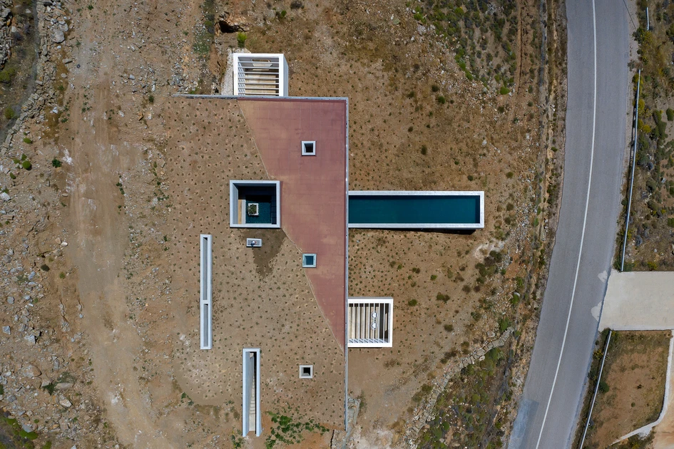 Partly covered by the hillside, The Lap Pool House (top) features views from covered terraces (middle) and an extra-long pool that stretches out towards the ocean (bottom). Photos Panagiotis Voumakis