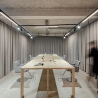 Grey in grey: Nuno Ferreira Capa arquitectura e design is responsible for the design of the four-storey retail space of Masion862 in Portugal. Opaque curtains define the areas. Photos: João Morgado
