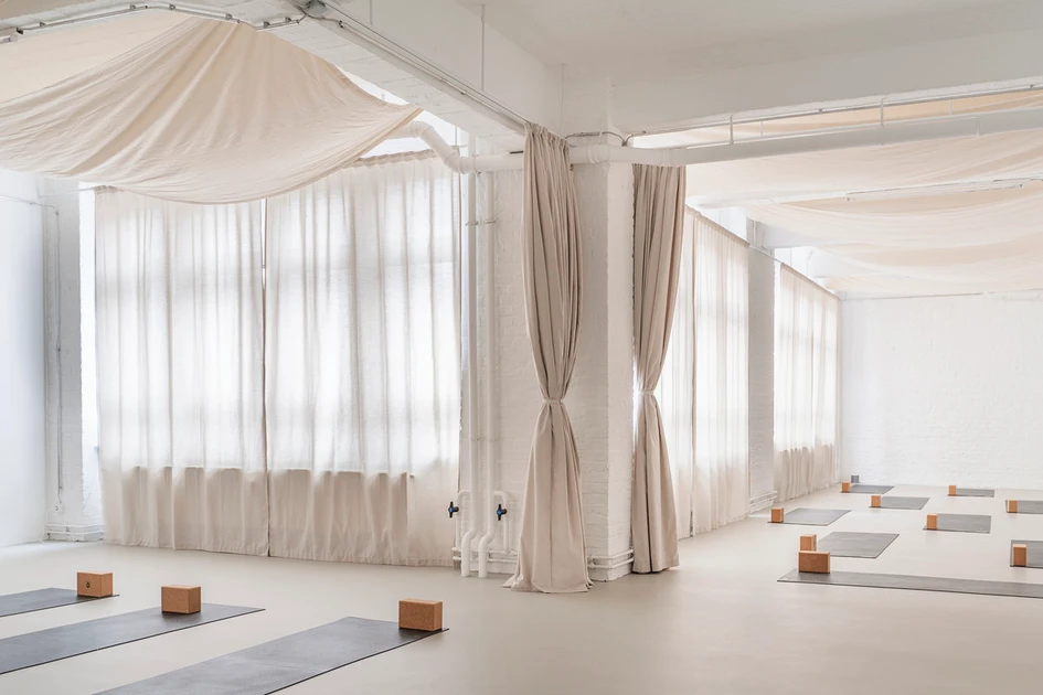 Everything is in flow at the Original Feelings Yoga Studio in Berlin. Some Place Studio's spatial concept with malleable materials and lots of fabric allows visitors to take a deep visual breath. Photos: Linus Muellerschoen