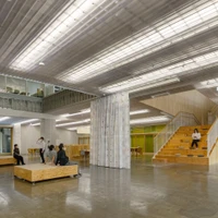 The public meeting space of the Children Health & Support Centre in Kitakami, Japan, manifests its connection to the city through its large windows. For some privacy, individual zones can be separated by curtains. Photos: Kai Nakamura