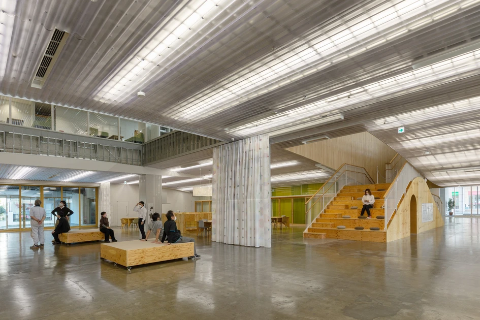 The public meeting space of the Children Health & Support Centre in Kitakami, Japan, manifests its connection to the city through its large windows. For some privacy, individual zones can be separated by curtains. Photos: Kai Nakamura