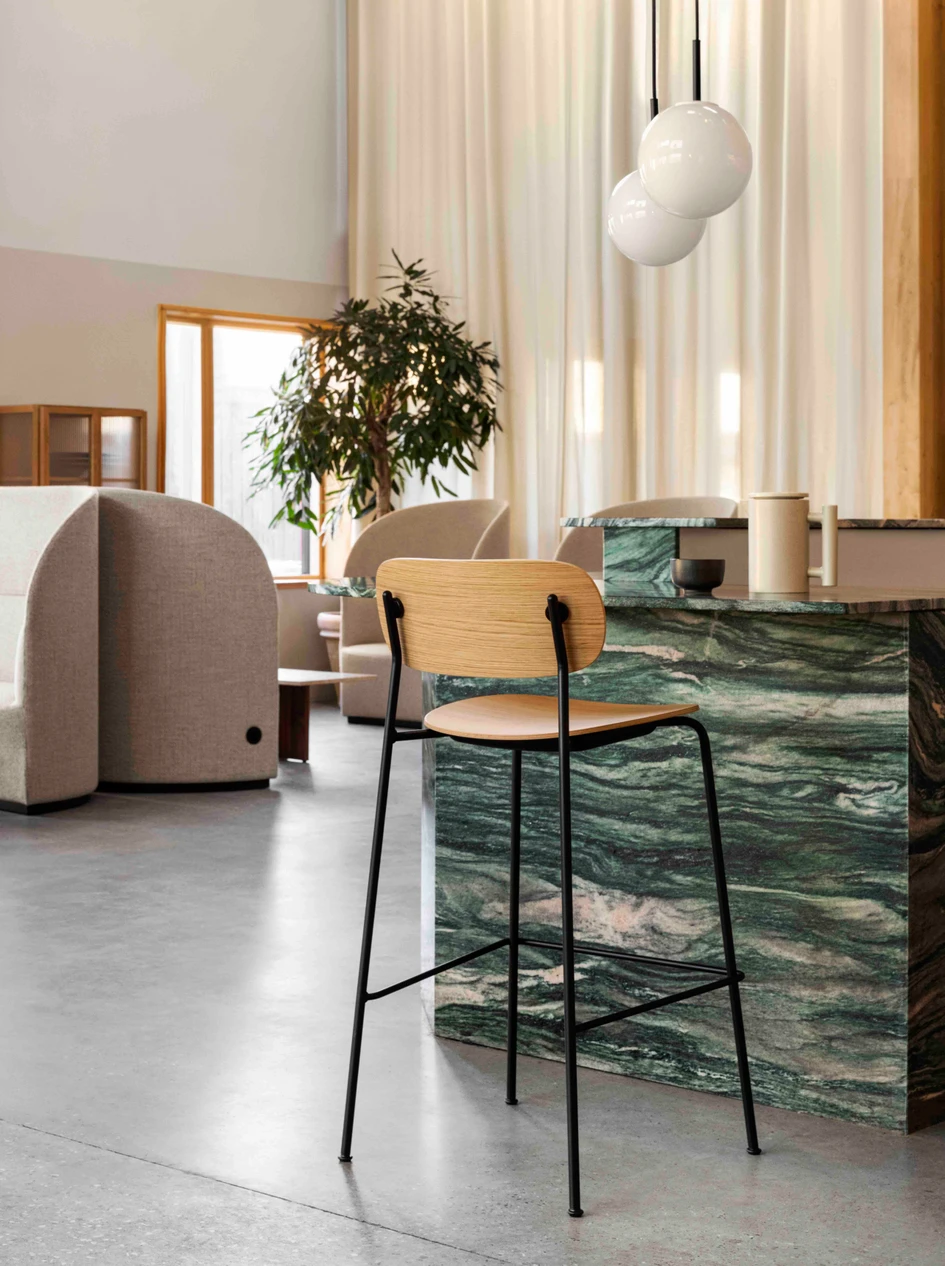 Cocooned shapes of the Tearoom collection offer privacy in public (above); while the Co Bar Chair offers an informal, yet comfortable perch for any occasion