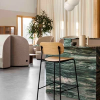 Cocooned shapes of the Tearoom collection offer privacy in public (above); while the Co Bar Chair offers an informal, yet comfortable perch for any occasion