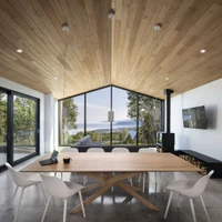 Le Littoral Residence’s well-balanced construction (top) with stand-out black Quebec granite kitchen island (middle) and gabled view from inside (bottom). Photos: Stéphane Brügger