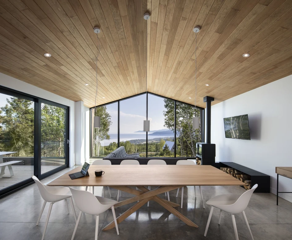 Le Littoral Residence’s well-balanced construction (top) with stand-out black Quebec granite kitchen island (middle) and gabled view from inside (bottom). Photos: Stéphane Brügger