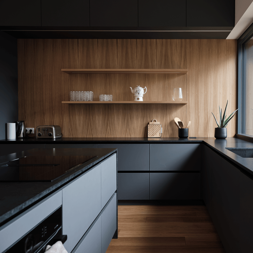 Read story Back to black: dark kitchens that help outline open interiors